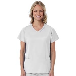 A mock wrap top in light grey, featuring short sleeves and two front pockets, worn by a smiling woman.
