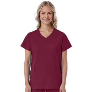A womans mock wrap top in a rich burgundy colour with short sleeves and two front pockets. It features a logo.