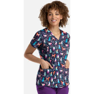 A women's V-neck top featuring a playful print of various cats and dogs on a dark background, with pockets.