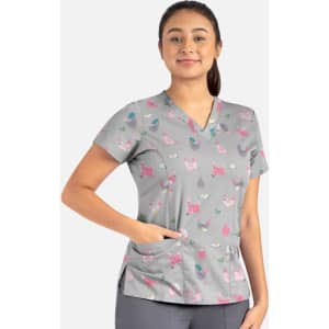 A grey women's V-neck top featuring a playful pattern of colourful cats and other motifs, with visible pockets.