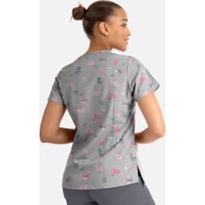 A grey women's V-neck top featuring a playful pattern of colourful cats and accessories, with a logo present.