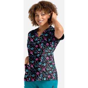 A floral print women's V-neck top featuring a black background with pink and blue flowers, and two pockets.
