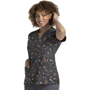 A printed curved V-neck top in black with a colourful pattern featuring various objects, including animals.