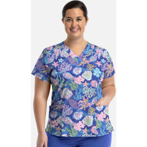 A women's V-neck top featuring a vibrant coral and ocean-themed print on a blue background, with a logo on the chest.