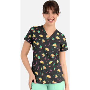 A women's v-neck top featuring a black background with colourful prints of tacos, cacti, and cherries.