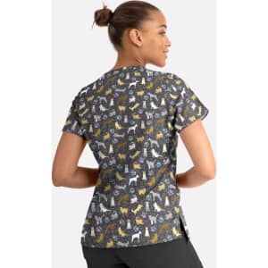 A women's V-neck top featuring a multicoloured dog print on a dark background. The top has a logo on it.