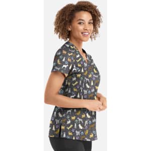 A women's V-neck top featuring a multi-coloured dog print on a black background, with a logo present.
