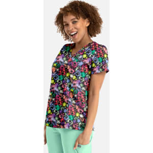 A vibrant women's V-neck top featuring a multi-coloured skull print on a black background. It has a logo.