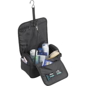 A black business wash bag opened, featuring various toiletries, a comb, and a hanging hook for easy access.