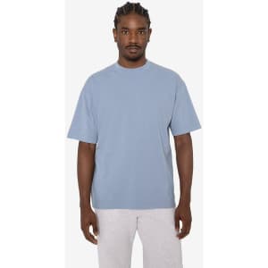 A short sleeve crewneck tee in a soft blue colour, featuring a relaxed fit and a logo on the side.