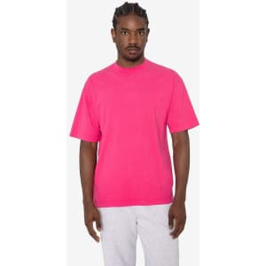 A bright pink short sleeve crewneck tee with a relaxed fit, featuring a logo on the front.