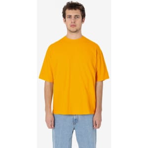 A vibrant orange short sleeve crewneck t-shirt with a relaxed fit and a branding logo.