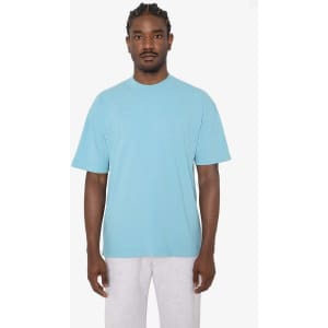 A crewneck t-shirt in light blue, featuring short sleeves and a relaxed fit, with a logo visible.