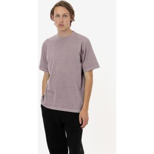 A short sleeve crewneck tee in a muted mauve colour, featuring a plain design and a small logo.