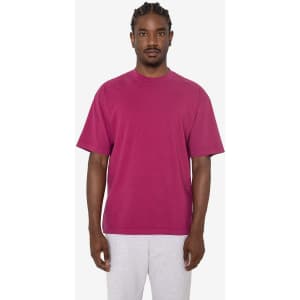 A short sleeve crewneck tee in a vibrant magenta colour, featuring a relaxed fit and a logo.