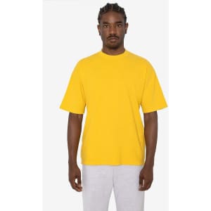 A short sleeve crewneck tee in bright yellow, featuring a relaxed fit and a logo on the chest.