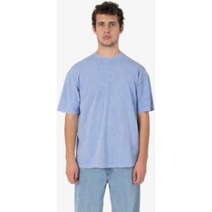 A blue short sleeve crew tee, featuring a relaxed fit and mineral wash texture, displayed on a model.