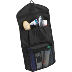 A black toiletry bag with various personal care items, including a toothbrush, comb, and grooming products.