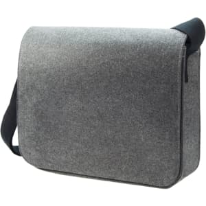 A grey satchel bag with a flap closure and an adjustable strap, featuring a logo on the front.