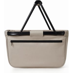 A beige shopping bag with a black handle and a zippered pocket on the back.