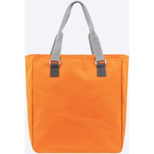 An orange reusable grocery bag with grey handles, featuring a simplistic design. The bag has a logo on it.