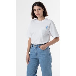 A white short sleeve pocket tee with a casual fit, featuring a branding logo and styled with high-waisted jeans.