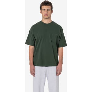 A short sleeve, garment-dyed pocket tee in dark green, featuring a front pocket and a casual fit.