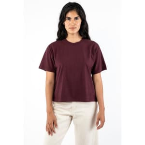 A maroon garment dye wide tee with short sleeves, displayed on a model against a plain background.