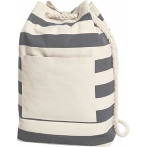 A striped beach backpack in cream and navy blue with a drawstring closure and a front pocket. It features a rope handle.