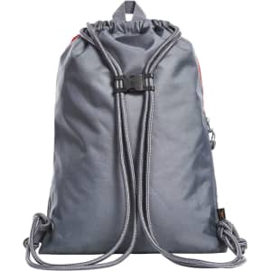 A grey drawstring bag with adjustable cords and a buckle fastening. It features a logo on the surface.