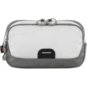 A white and grey waist bag with a zippered opening and a small logo. It features a sleek, modern design.