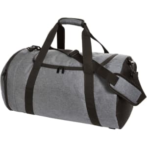 A grey duffel bag with black accents, featuring dual handles and a detachable shoulder strap. It has a logo.