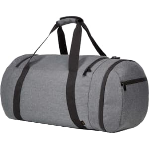 A grey duffle bag with black straps and zippers, featuring a rounded shape and spacious exterior.