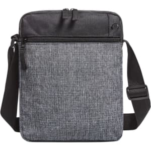 A grey crossbody bag with a structured design, featuring a zippered compartment and an adjustable strap.
