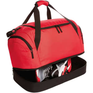 A red duffle bag with black accents featuring a zippered compartment for shoes. It has sturdy handles for easy carrying.