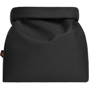 A black thermo bag with a foldable top, featuring a small branding label. Ideal for keeping items cool.