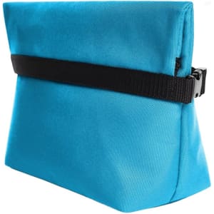 A blue cooler bag featuring a black strap, designed for carrying drinks and food. It has a logo on the side.