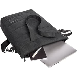 A dark grey laptop bag features a strap, partially unzipped, revealing a laptop and a notebook inside. It has a logo.