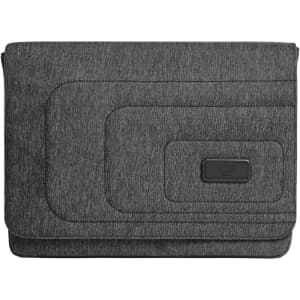 A laptop bag in a dark grey fabric featuring subtle textured patterns and a logo badge.