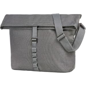 A grey Loom Shoulder Bag with a fold-over flap and adjustable strap, featuring a logo.