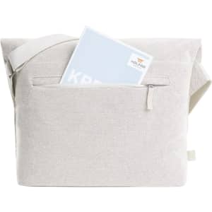 A light grey satchel bag with a shoulder strap and a front pocket, holding a document or notebook inside.