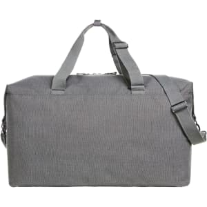 A grey duffle bag with dual handles and a detachable shoulder strap, featuring a simple design and a logo.