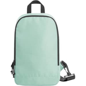 A mint green backpack with a single strap, featuring a zippered pocket and a logo.