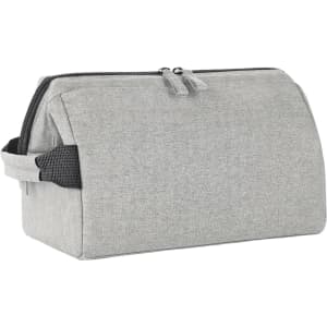 A grey toiletry bag with a zip closure and side handle, featuring a simple design and a logo.
