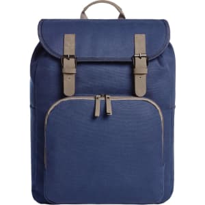 A navy blue backpack with a flap closure, featuring buckles and a front zippered pocket. It has a branding logo.