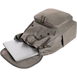 A grey backpack with a top compartment and a laptop partially visible at the front, featuring a logo.