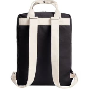 A black backpack with cream-coloured straps and a top handle, featuring a minimalist design and a logo.