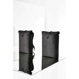 Two grey roller backpacks with a sleek design, featuring a logo, placed on a reflective surface.