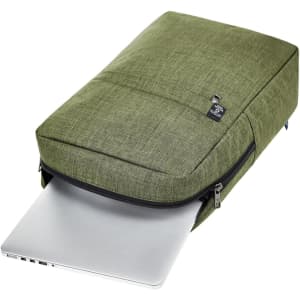 A green backpack designed for laptops, featuring a textured fabric and a zippered compartment with a silver laptop partially visible.