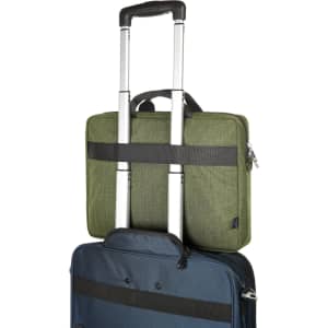 A laptop bag in olive green, featuring a handle and straps, positioned on top of a blue suitcase.